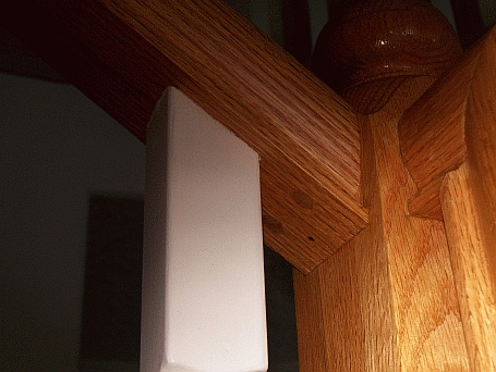 Photo of the top of a newel showing the angle of the top hand railing.